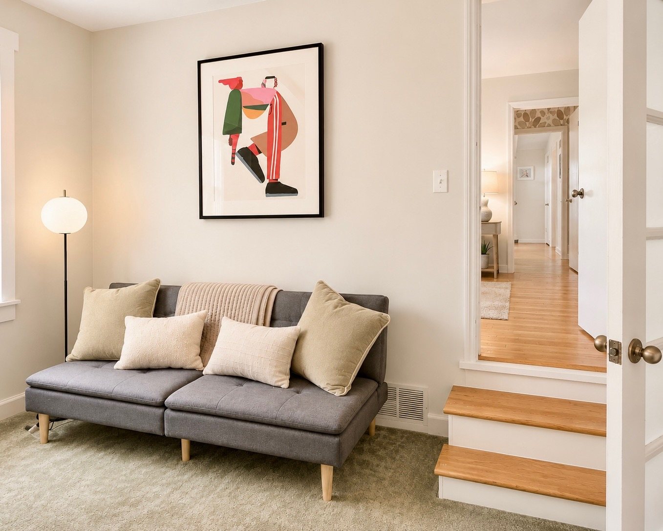 Bonus room off the primary suite with daybed and carpet